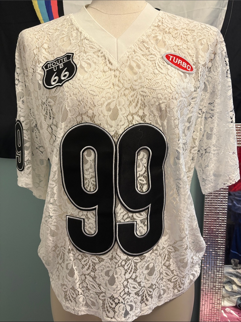 Women's White Lace Jersey Top with Black '99' Appliqué